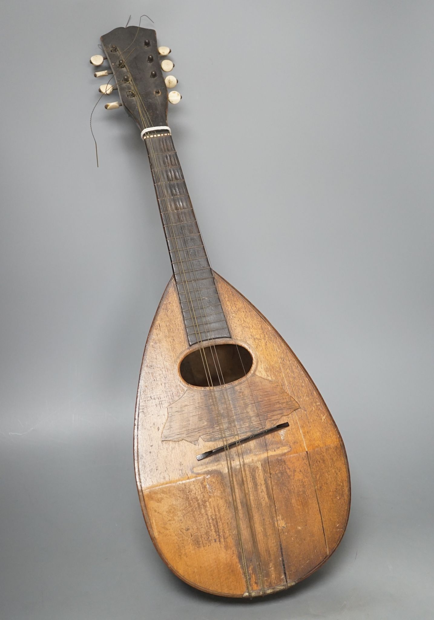 A rosewood and boxwood mandolin with bone pegs, circa 1900